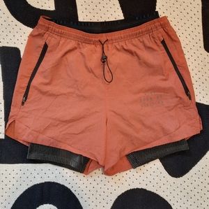 Dusty peach Nike running shorts with detachable biker shorts